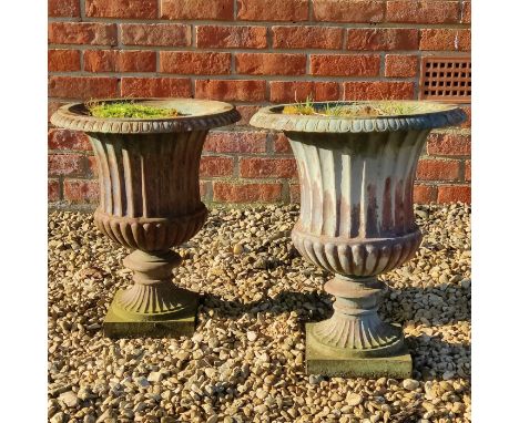 A pair of cast iron campana-style urns With blue paint to the surface.41cm x 50cmQty: 2Oxidisation throughout, notable loss t