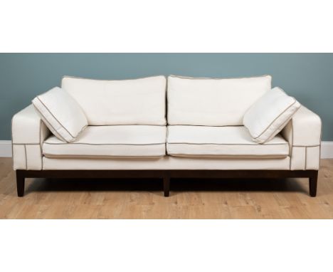 An Art Deco-style sofa and a matching armchair Originally purchased from Sweetpea &amp; Willow. The cream upholstery with gre