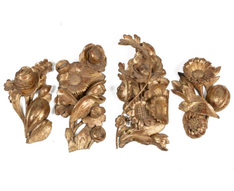 A group of antique carved oak gilt gesso flower ornaments Possibly originally architectural elements.The largest 22cm wide x 