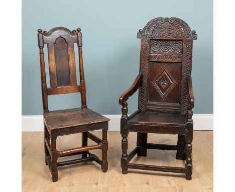 Two oak chairs An 17th century wainscot chair with a chip-carved decorated panel back and a two-plank seat; together with an 