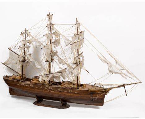 Two wooden model boats The first a modern model of the Cutty Sark; the second a model Thames barge.The Cutty Sark 125cm long 