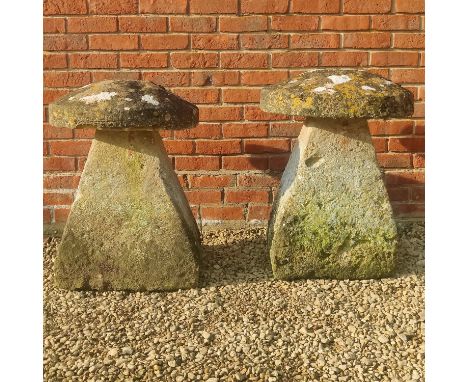 Two limestone staddle stones The tops joined to the bases.56cm wide x 80cm highQty: 2Notable weathering throughout. Both with