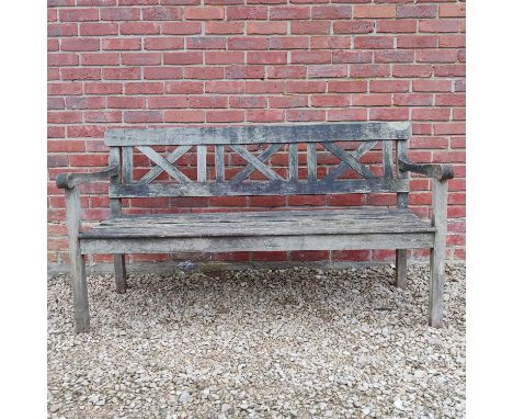 A teak three-seater garden bench The back with X-framed splats and slatted seat.155cm wide x 62cm deep x 85cm highQty: 1In ve