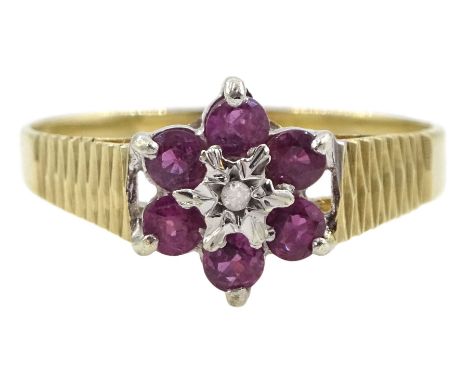 9ct gold ruby flower head cluster ring, hallmarked Condition Report:Approx 1.86gm, size Q/R