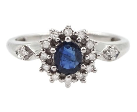 9ct white gold oval sapphire and round brilliant cut diamond cluster ring, with diamond set shoulders, hallmarked Condition R