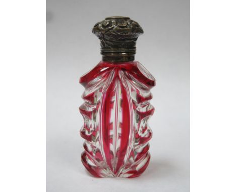 Victorian ruby overlay cut glass scent / perfume bottle, with ornately repousse decorated hinged cap and glass stopper, 7cms 