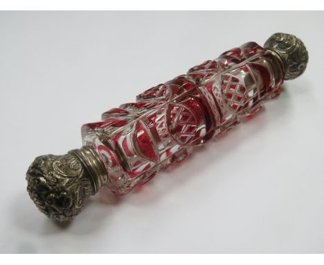 Victorian ruby red overlaid cut glass double ended scent bottle, with ornately repousse decorated hinged caps and single glas