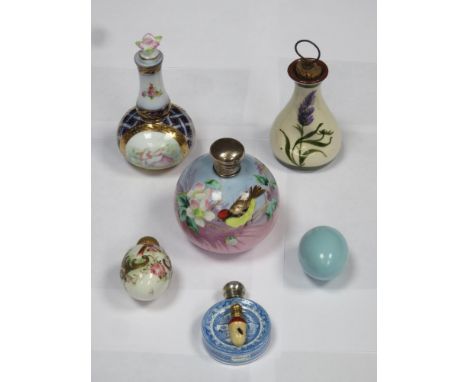 Parcel of seven ceramic perfume bottles, various sizes and designs inc. silver topped and hand painted globular bottle, etc 