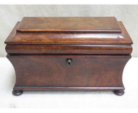 A Regency style 19th century walnut veneered sarcophagus form tea caddy, with two lidded compartments and  mixing bowl, on ra