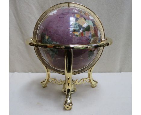 A decorative table top gemstone globe suspended on gilt metal base with integral compass, Approx. 50cms high 