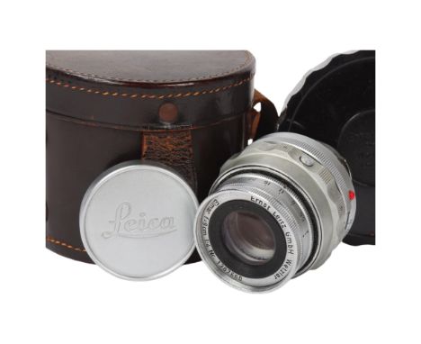 A Leica Ernst Leitz GmbH Wetzlar Elmar F=9cm 1:4 NR 1387660 camera lens, with Leica lens caps and original leather case