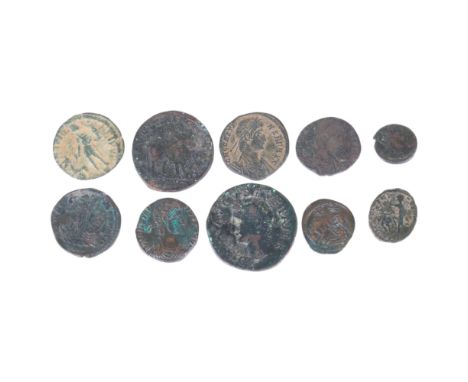 A collection of 4th Century AD Roman bronze coins, including Constantine I, Constans Centenionalis, Julina II, Magus Maximus 
