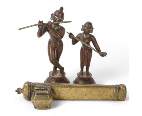 Islamic brass scribe's pen holder/inkwell, length 21cm, and 2 Indian bronze dancing figures, largest height 15cm (3)