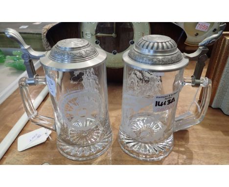 Two glass Domex tankards with pewter lids, one etched with fish, the other sailing ships. P&amp;P Group 3 (£25+VAT for the fi
