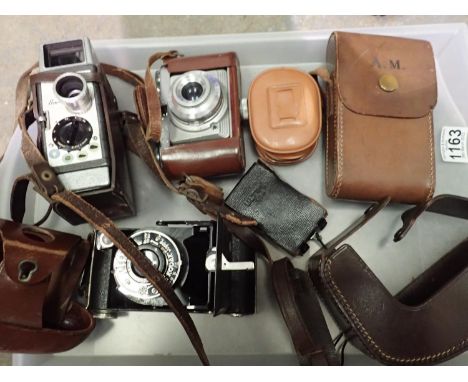 Bell and Howell 624 8mm camera, Edixa 1-L and Kodak Junior folding camera, all leather cased with two light meters (5). P&amp