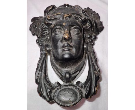 Cast iron door knocker in the form of a lady, H: 18 cm. P&amp;P Group 1 (£14+VAT for the first lot and £1+VAT for subsequent 