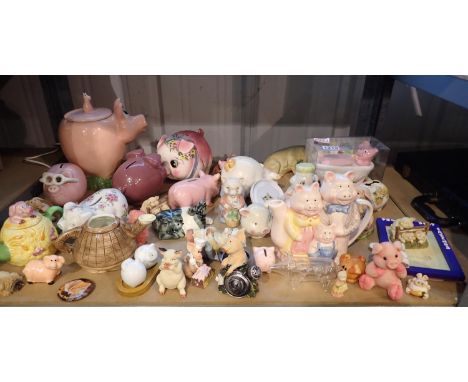 Shelf of mainly ceramic pigs, including moneyboxes. Not available for in-house P&amp;P 