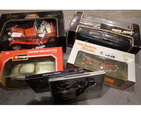 Three Burago model cars and a further example, 1:18 and 1:24 scale, all boxed. P&amp;P Group 2 (£18+VAT for the first lot and