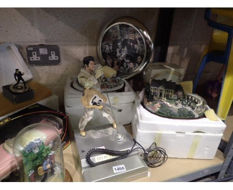 Collection of mixed Elvis Presley figurines and collectables to include an Elvis telephone, toy car and a clock. Not availabl