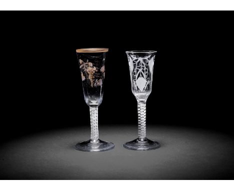 A gilt opaque twist wine flute and an ale glass, circa 1765With double-series stems, the wine flute attributed to the London 