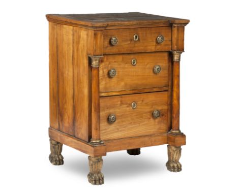 A 19th century Piedmont fruitwood commodeThe shaped top above three drawers with turned column, raised on carved feet, 66cm w