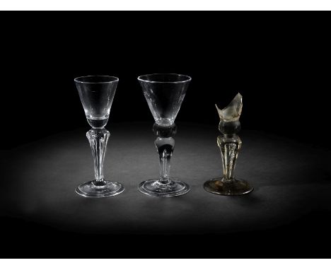 Two moulded stem wine glasses and a fragmentary 'God Save King George' wine glassCirca 1714-25One glass with a small round fu