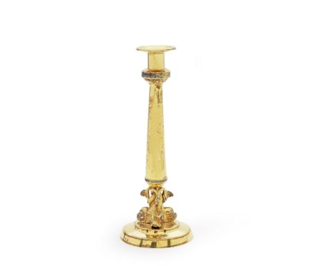 A 19th century silver gilt candlestickpossibly German, maker's mark 'SC'The tapering stem supported on a dolphin support, wit