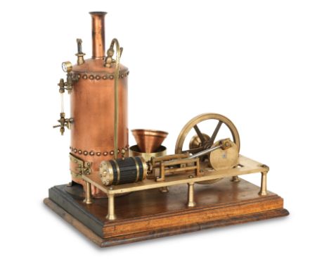 A Bassett Lowke vertical stationary reciprocating steam engine modelMounted on a rectangular mahogany base with moulded edge,