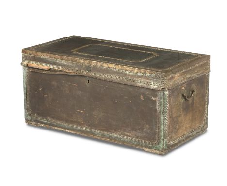 An early 19th century leather and brass bound trunkOf rectangular form with close nail decoration and iron swing handles, 107