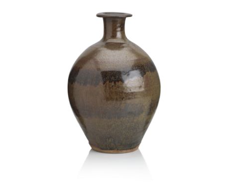 Bernard Leach (British 1887-1979): a bottle vaseStoneware, covered in a dark brown tenmoku glaze, 42cm high, impressed BL and