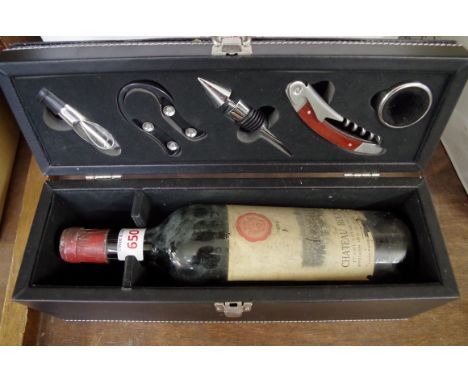 A bottle of 1950 Chateau Rousset Cote de Bourg, in presentation box with five various wine tools. 
