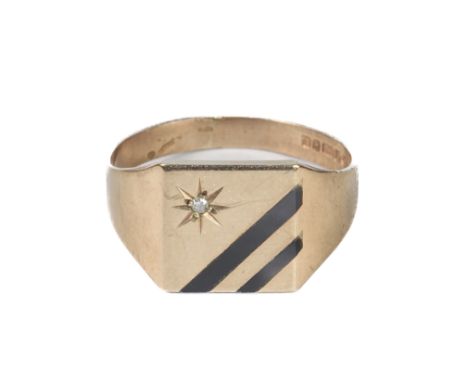 A 9ct gold, onyx and diamond signet ring - hallmarked Birmingham 1990, size R.