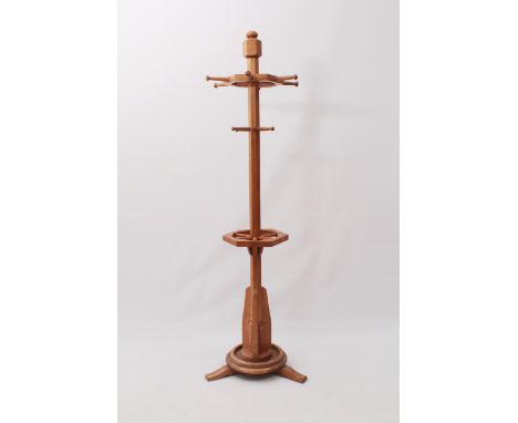 A honey oak coat, hat and stick stand in the Arts &amp; Crafts style - late 20th century, the hexagonal column with a spoked 