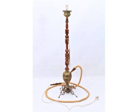 A converted Indian turned wood, brass and enamel hookah pipe standard lamp - mid-20th century, standing upon four pieced scro