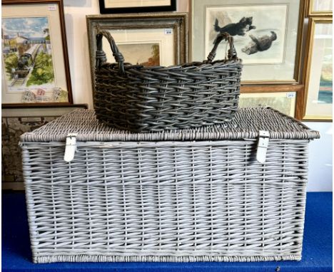 A large, grey painted wicker hamper or trunk by Daylesford Organics - with white leather hinges and buckled straps and Dayles