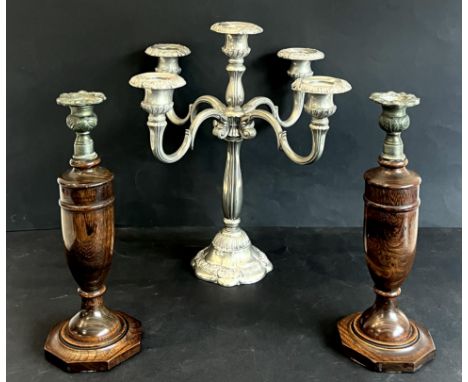 A plated metal five light candelabra - late 20th century, 35cm high; together with a pair of turned oak and spelter candlesti