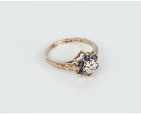 A 9ct gold, sapphire and diamond girl's cluster ring - hallmarked London 1992, size E/F.