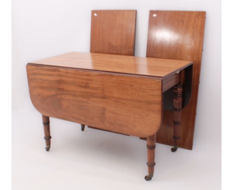An fine quality late-Regency mahogany Pembroke style extending dropleaf dining table - c.1830, with two extension leaves, the