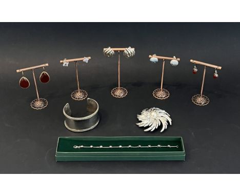 A small collection of silver and costume jewellery - including a Sarah Coventry foliate and faux-pearl brooch, 7cm diameter; 
