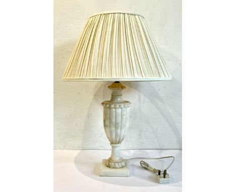 An Italian carved marble urn-form table lamp - second half 20th century, the gadrooned urn with beaded borders and lappet car