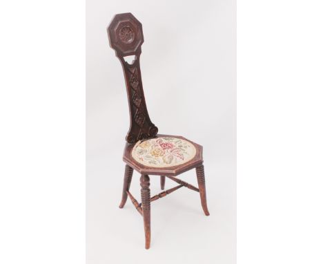 An early 20th century carved and stained beech and walnut spinning chair - the slender waisted back carved with floral lozeng