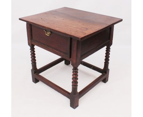 A late 17th / early 18th century oak single-drawer centre table - the boarded rectangular top over panelled sides and back, t