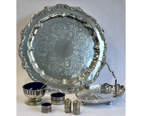 A silver plated salver - 'Heritage' by 1847 Rogers Bros, the shaped rim with floral and foliate decoration, the centre chased