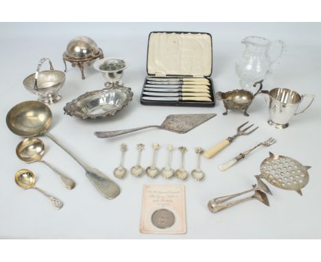 A small collection of silver plated ware - including a soup ladle; a dome-top muffin dish; a pierced sugar basket with glass 