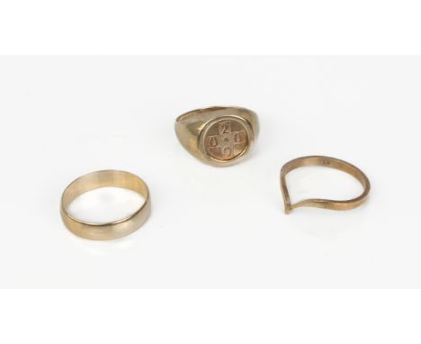 Three 9ct yellow gold rings - London and Birmingham hallmarks, comprising a year '2000' signet ring, size M; a wedding band, 