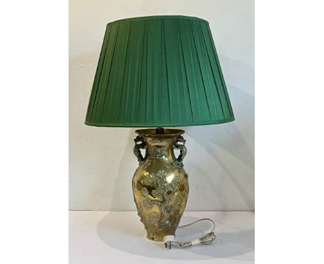 A Chinese polished bronze vase lamp - 20th century, of baluster form with twin kylin handles, decorated in relief with a phoe