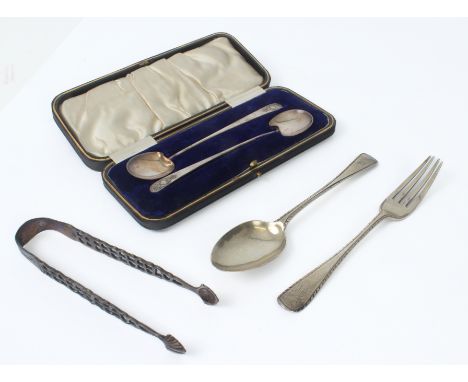 A small group of silver - comprising a pair of George III cast silver shell-bowl sugar tongs, maker IS (probably John Sheklet