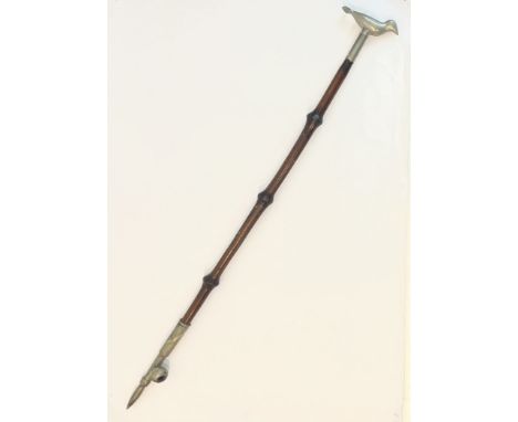 A Chinese novelty opium pipe walking cane - bamboo with plated metal mounts and bird handle, unscrewing to reveal the mouthpi