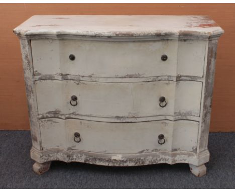 A French 19th century style distressed painted serpentine commode - late 20th century, with three drawers with cast-metal rin
