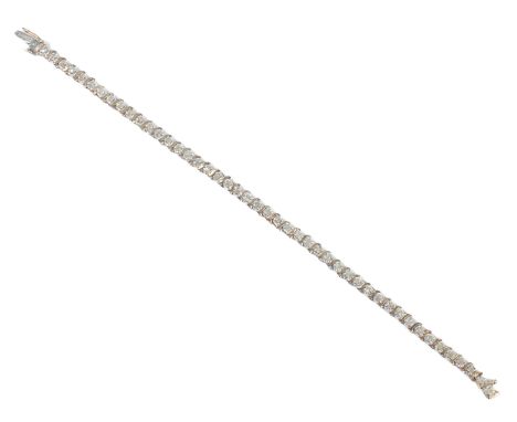 A 9ct two-colour gold and diamond tennis bracelet - Sheffield hallmarked, 18cm long.